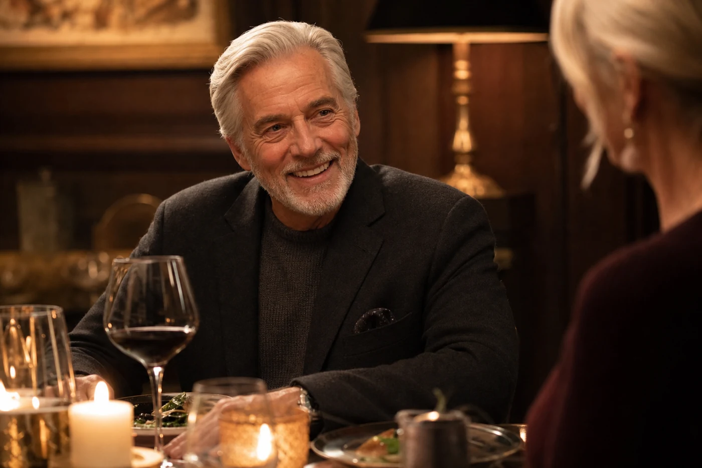 Patient smiling with renewed confidence during an elegant dinner